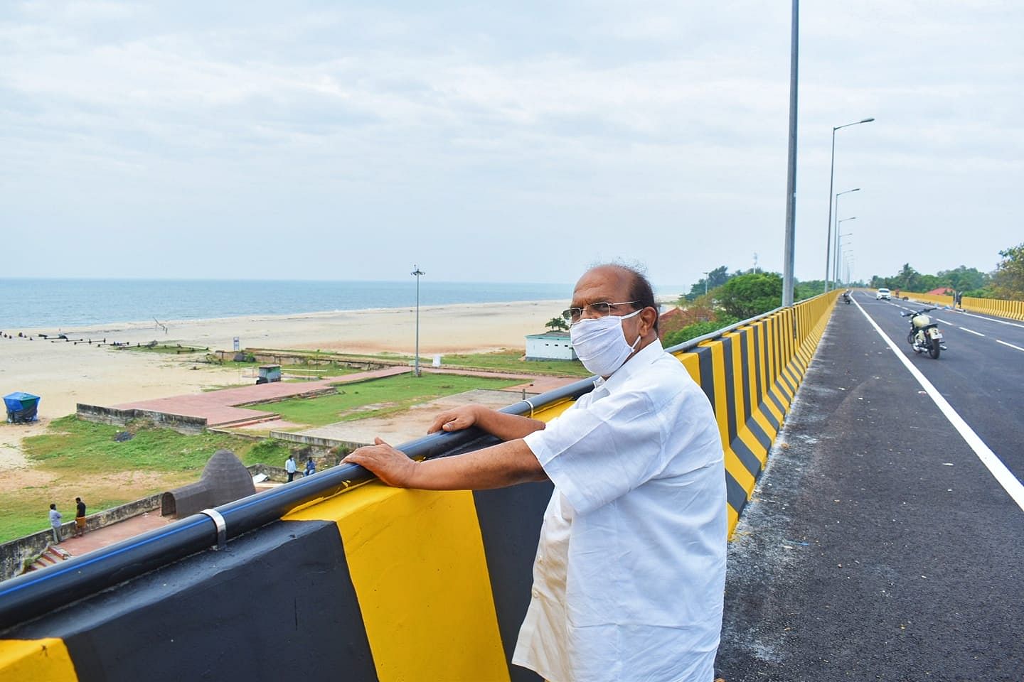 Kerala public works minister G Sudhkaran at the new Alappuzha NH bypass that passes along the beach on Thursday. Credit: Special Arrangement