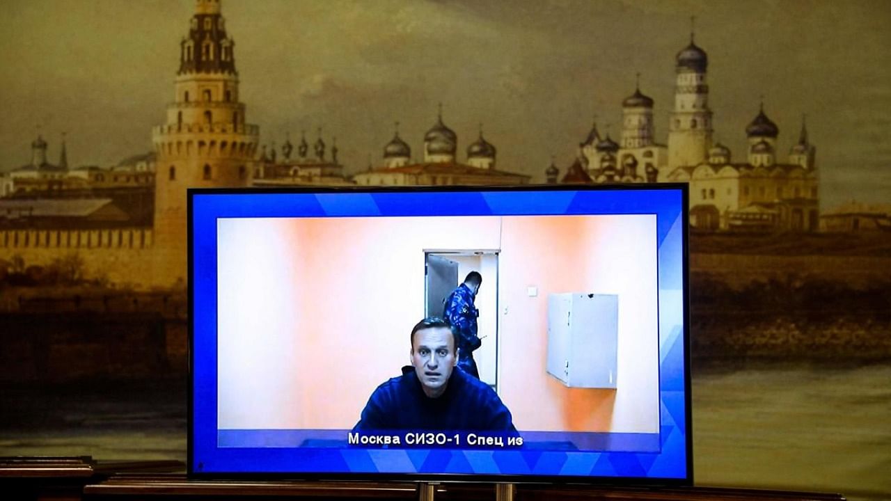 Opposition leader Alexei Navalny appears on a screen set up at a hall of the Moscow Regional Court via a video link from Moscow's penal detention centre Number 1 (known as Matrosskaya Tishina) during a court hearing of an appeal against his arrest, in Krasnogorsk. Credit: AFP.