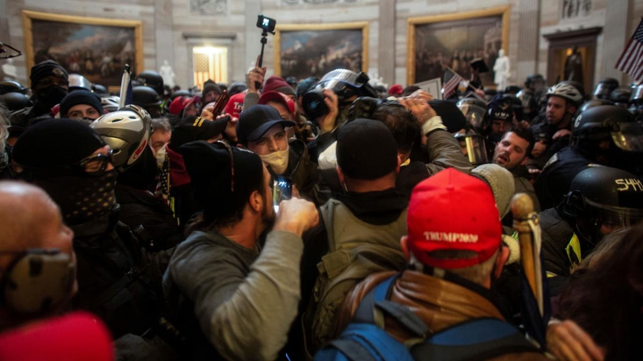 Pro-Trump protesters storm the US Capitol during a rally to contest the certification of the 2020 US presidential election results by the US Congress, at the Capitol Building in Washington. Credit: Reuters file photo.