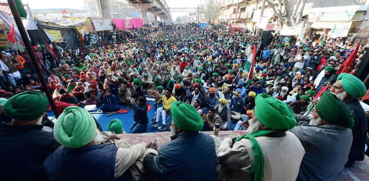Farmer leaders address a gathering during their ongoing protest at Tikri border, a day after the farmers' tractor rally, in New Delhi. Credit: PTI Photo