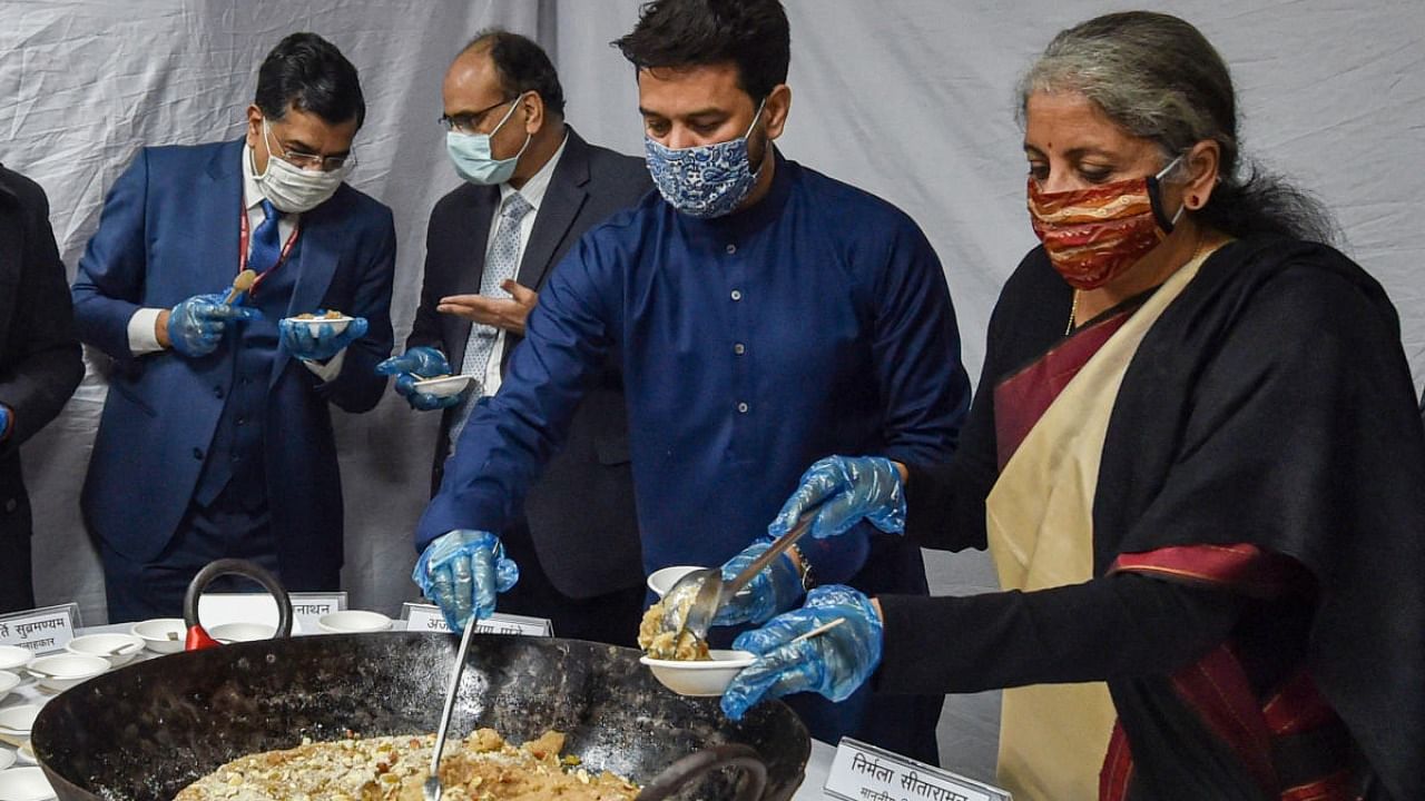 Finance Minister Nirmala Sitharaman along with Minister of State for Finance Anurag Singh Thakur during 'Halwa' ceremony to mark the commencement of final stage of Union Budget 2021-22 and launch of 'Union Budget Mobile App' to provide easy and quick information to all stakeholders, in New Delhi, Saturday, Jan. 23, 2021. Credit: PTI Photo