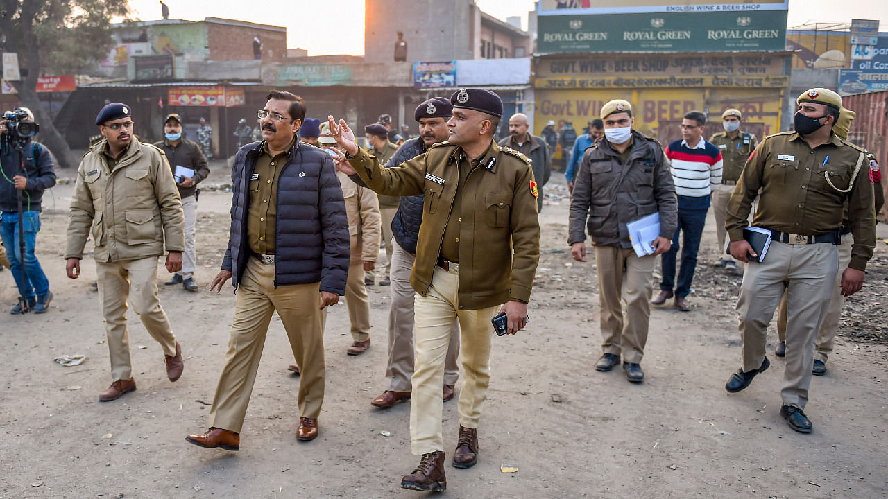Senior Delhi Police officials inspect the site of farmers' agitation against the new farm laws, at Singhu border. Credit: PTI Photo