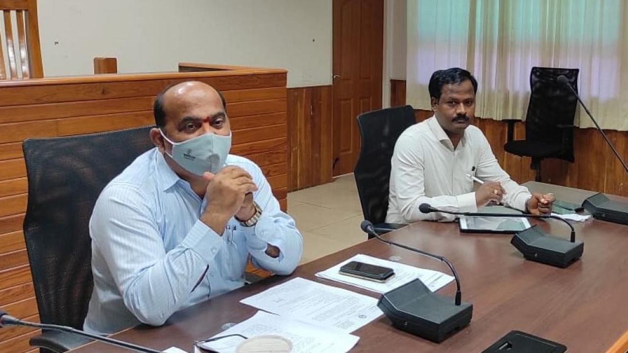 Additional Deputy Commissioner Sadashiva Prabhu chairs a meeting at the DC office hall in Manipal. Credit: DH Photo.