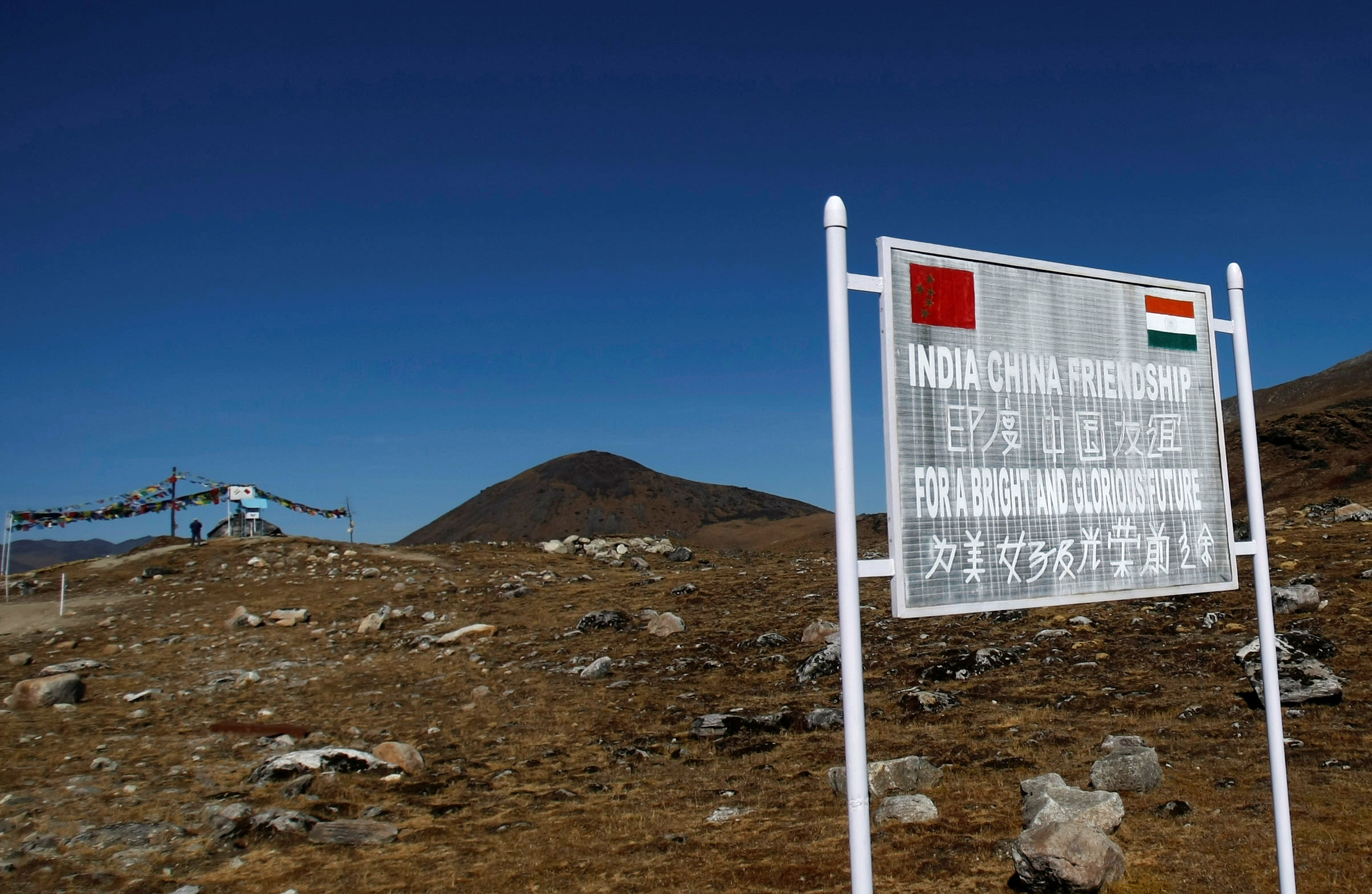 A signboard is seen from the Indian side of the Indo-China border at Bumla, in Arunachal Pradesh. Credit: REUTERS Photo