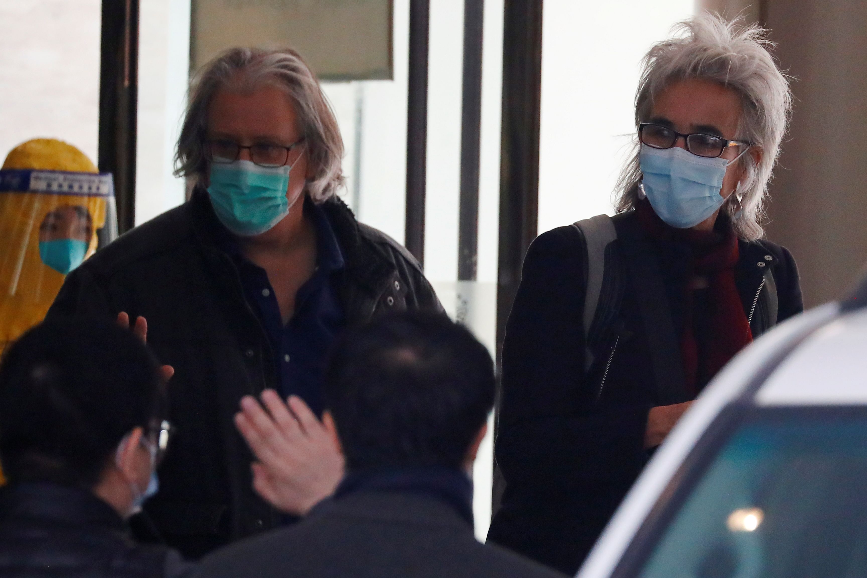 Members of the World Health Organisation (WHO) team tasked with investigating the origins of the coronavirus disease (COVID-19) pandemic leave their quarantine hotel in Wuhan, Hubei province, China January 28, 2021. Credit: REUTERS
