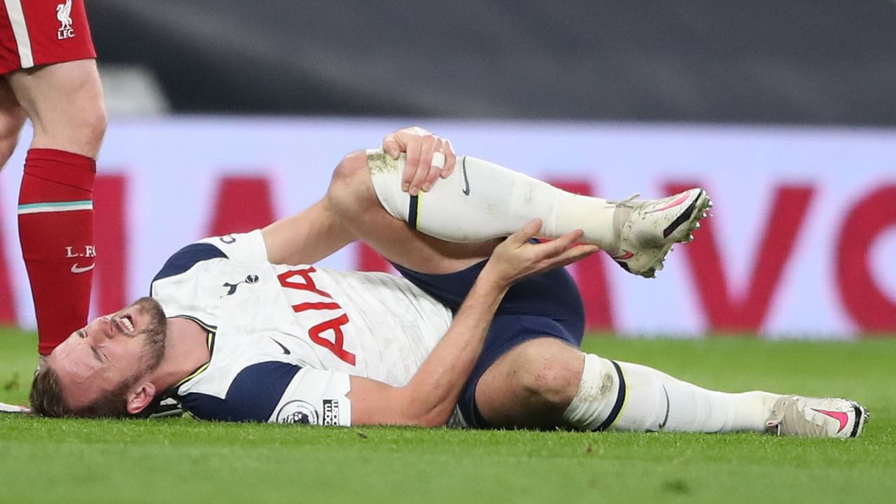 Tottenham Hotspur's English striker Harry Kane lies on the pitch with an injury during the English Premier League football match between Tottenham Hotspur and Liverpool at Tottenham Hotspur Stadium in London. Credit: AFP Photo
