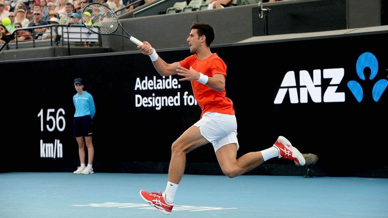 Men's world number one tennis player Novak Djokovic of Serbia hits a return against Jannik Sinner of Italy during the 'A Day at the Drive' exhibition match in Adelaide on January 29, 2021. Credit: AFP Photo