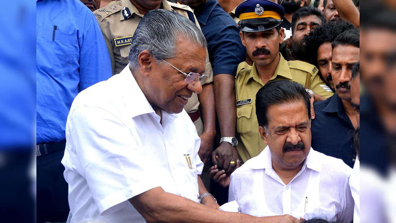 Kerala Chief Minister Pinarayi Vijayan (L) along with opposition leader Ramesh Chennithala. Credit: AFP File Photo