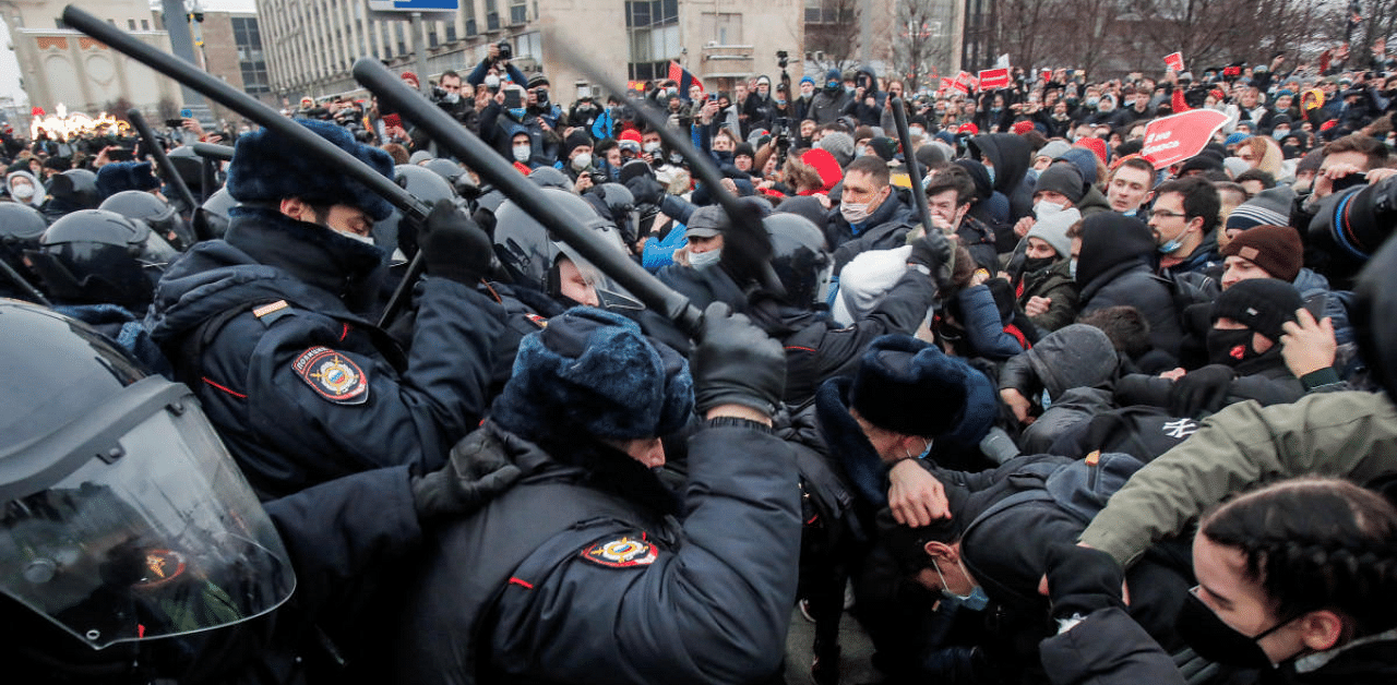 Law enforcement officers clash with participants during a rally in support of jailed Russian opposition leader Alexei Navalny in Moscow, Russia. Credit: Reuters Photo