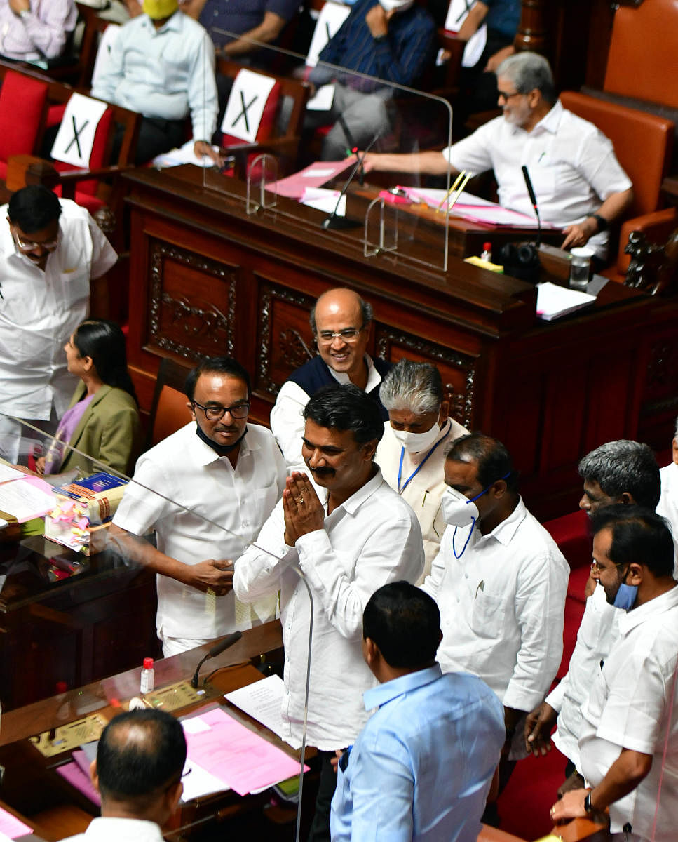 Newly-elected Deputy Chairman M K Pranesh of BJP greets the members in the Legislative Council on Friday. DH photo