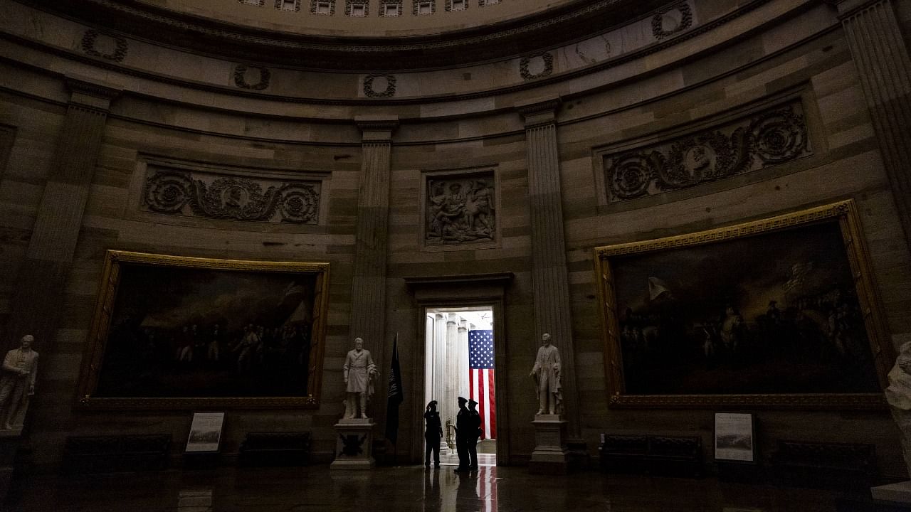 Capitol Police officers stand in a doorway to the Rotunda in the US Capitol in Washington DC. Credit: AFP File Photo