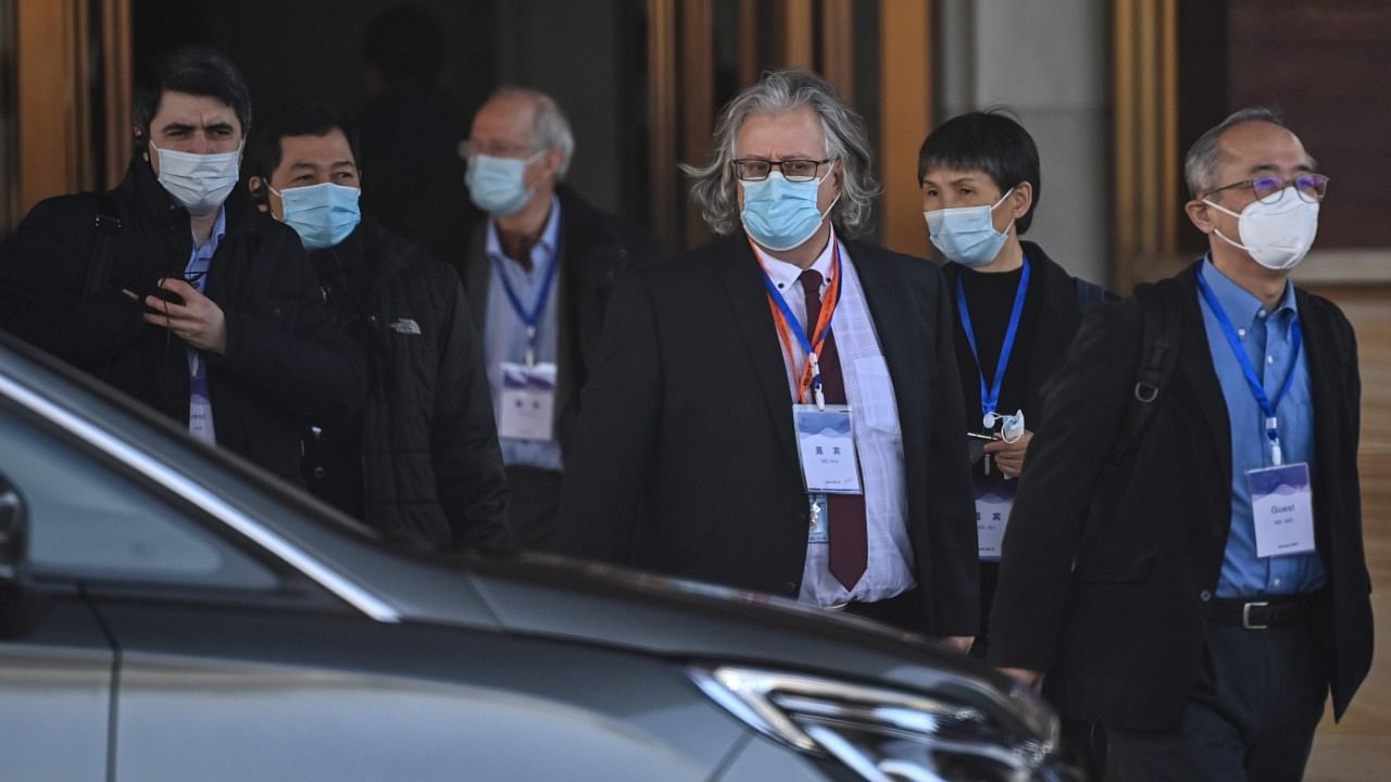 Members of the World Health Organization (WHO) team investigating the origins of the Covid-19 pandemic, leave the Hilton Wuhan Optics Valley Hotel where the team is currently based post-quarantine in Wuhan, China’s central Hubei province on January 29, 2021. Credit: AFP Photo
