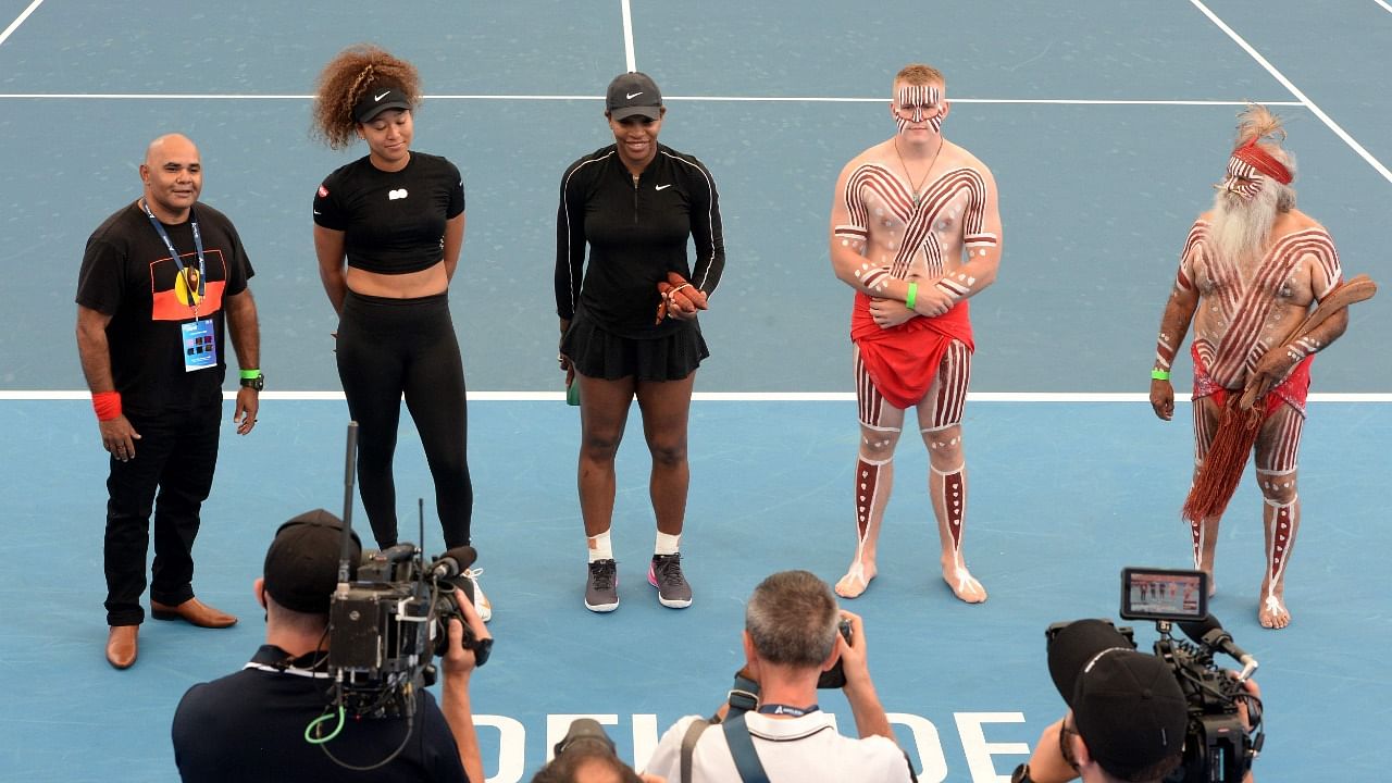 Serena Williams (C) of the US and Japan's Naomi Osaka (2nd L) pose for pictures before their women's singles match at the 'A Day at the Drive' exhibition tennis tournament in Adelaide. Credit: AFP Photo
