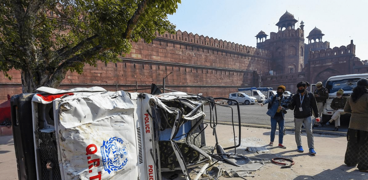 A damaged police jeep in the premises of Red Fort, a day after it was stormed by protesting farmers during their tractor march, in Delhi. Credit: PTi Photo