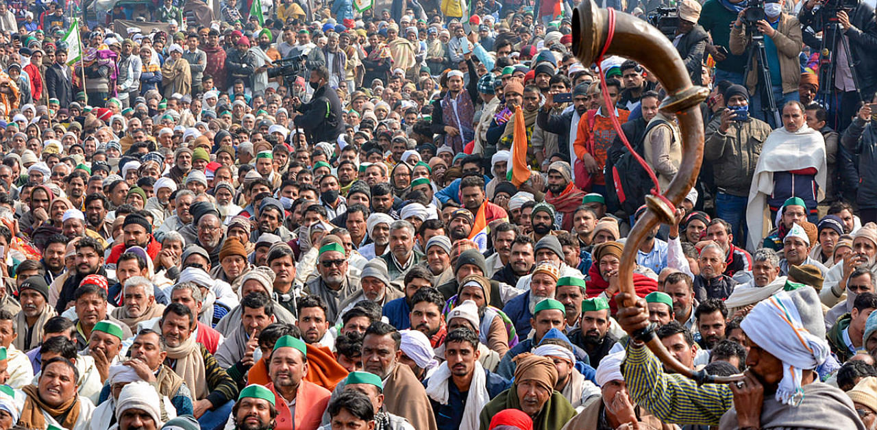 Villagers, farmers and supporters attend a 'Maha Panchayat', organised to mobilise support for the farmers' agitation at Delhi borders against Centre's farm reform laws, in Muzaffarnagar. Credit: PTI photo. 