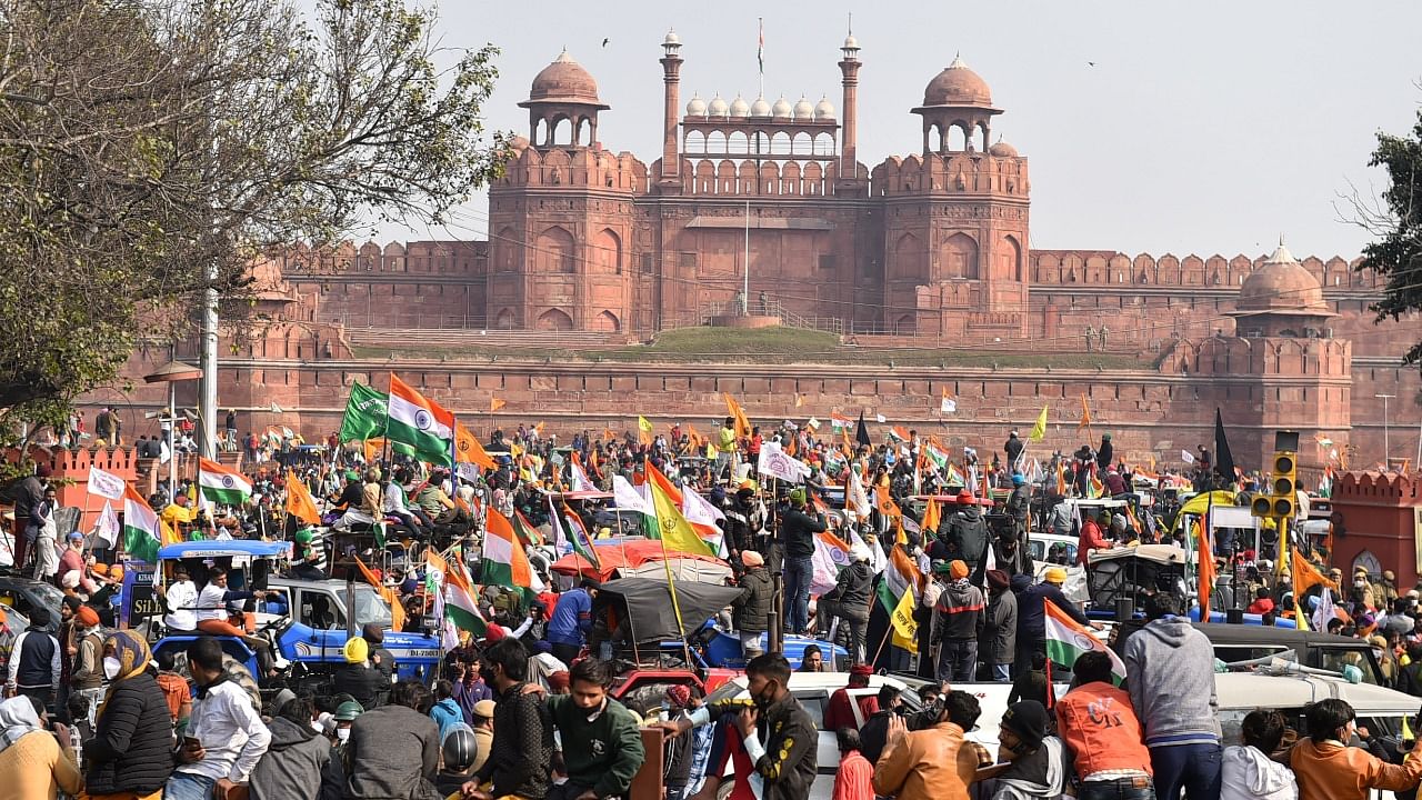 Farmers gather at Red Fort during their tractor parade on Republic Day, in New Delhi, Tuesday. Credit: PTI Photo