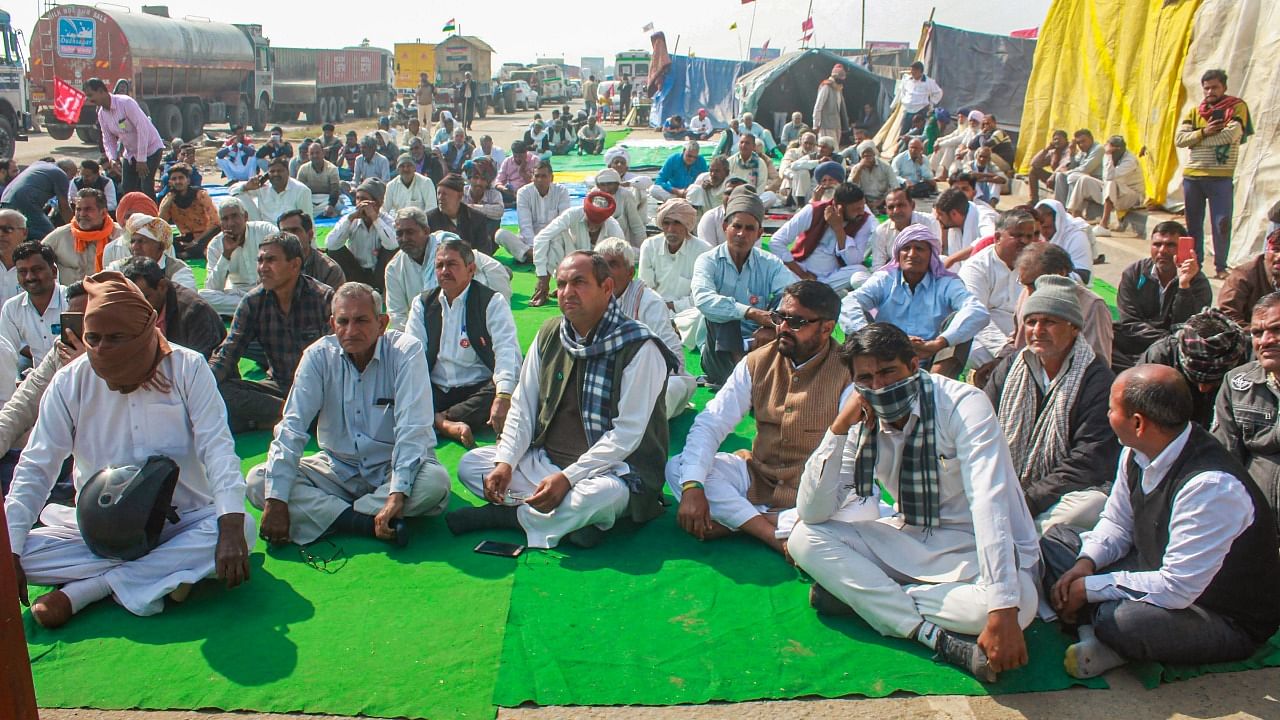 Farmers at Rajasthan- Haryana (Jaisinghpur Khera) border during their ongoing agitation against Centre's farm reform laws, at NH 48 in Rewari district. Credit: PTI Photo