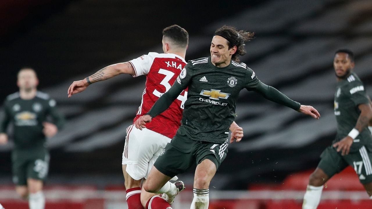 Arsenal's Granit Xhaka in action with Manchester United's Edinson Cavani during their goalless draw in the English Premier League at the Emirates Stadium in London. Credit: Reuters Photo