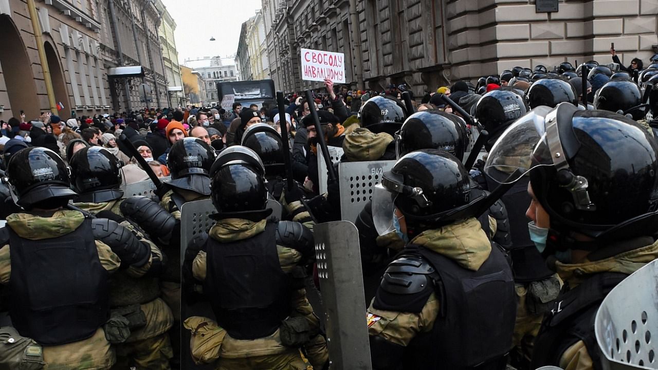 Law enforcement officers block protesters during a rally in support of jailed opposition leader Alexei Navalny in Saint Petersburg on January 31, 2021. Credit: AFP Photo