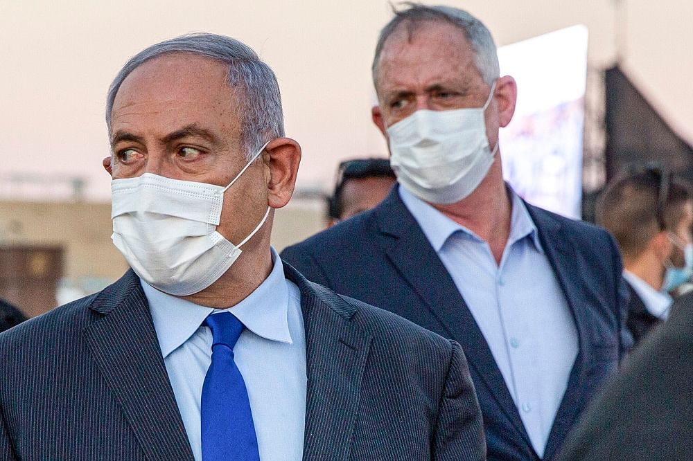 Israeli Prime Minister Benjamin Netanyahu (L) and his coalition partner Defence Minister Benny Gantz. Credit: AFP Photo