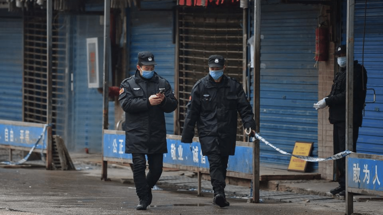 Security guards patrol outside the Huanan Seafood Wholesale Market in Wuhan on January 24, 2020. Credit: AFP Photo