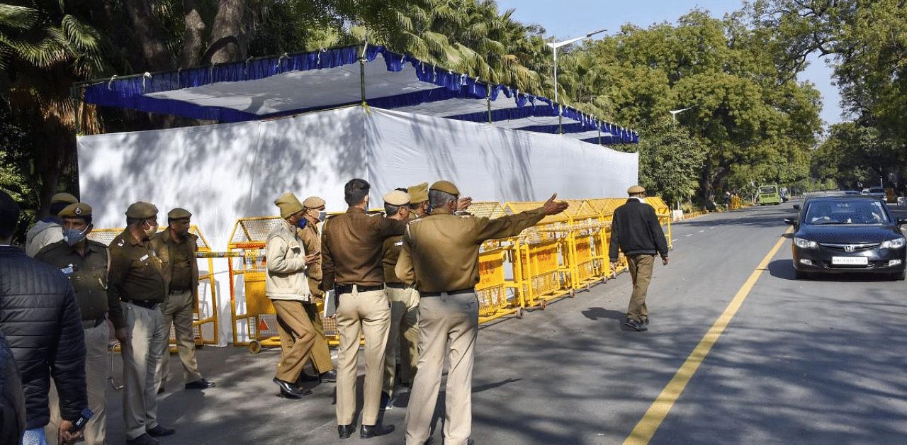 Security personnel keep vigil on the main road outside the Israel Embassy as it is reopened for commuters, days after a minor blast occurred near it, in New Delhi. Credit: PTI Photo