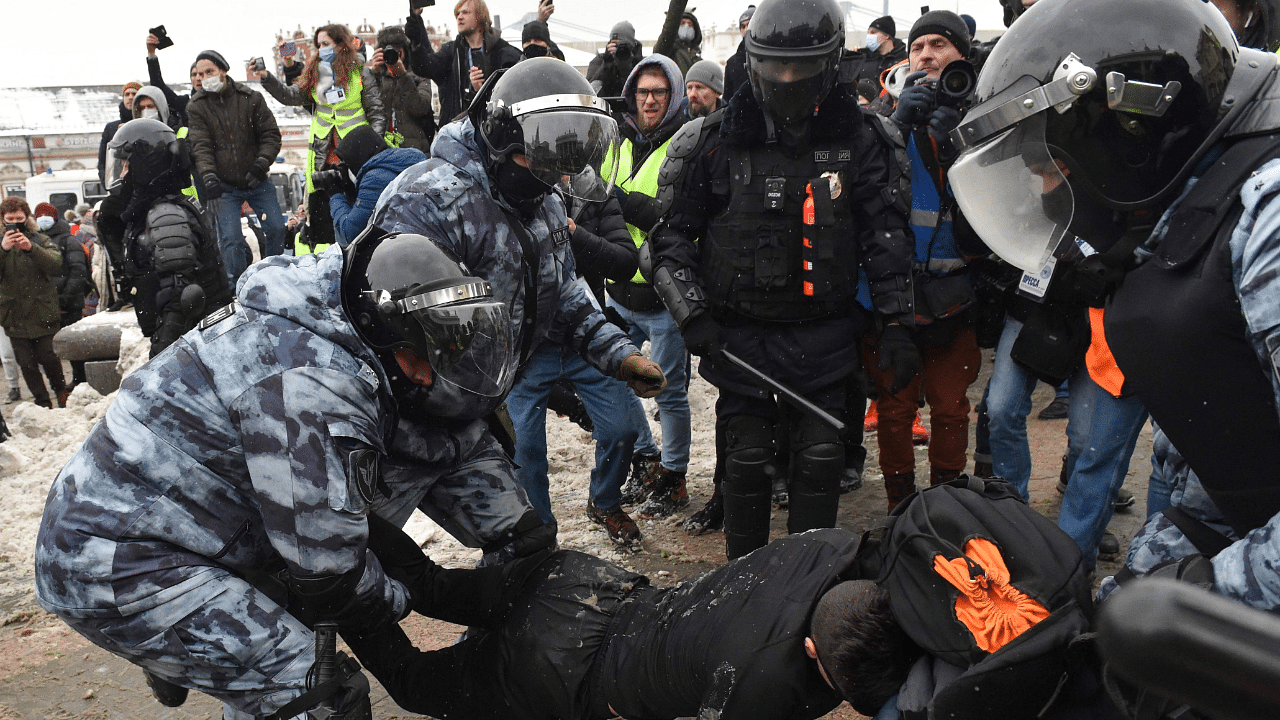 Riot police detain a man during a rally in support of jailed opposition leader Alexei Navalny in Moscow. Credit: AFP Photo