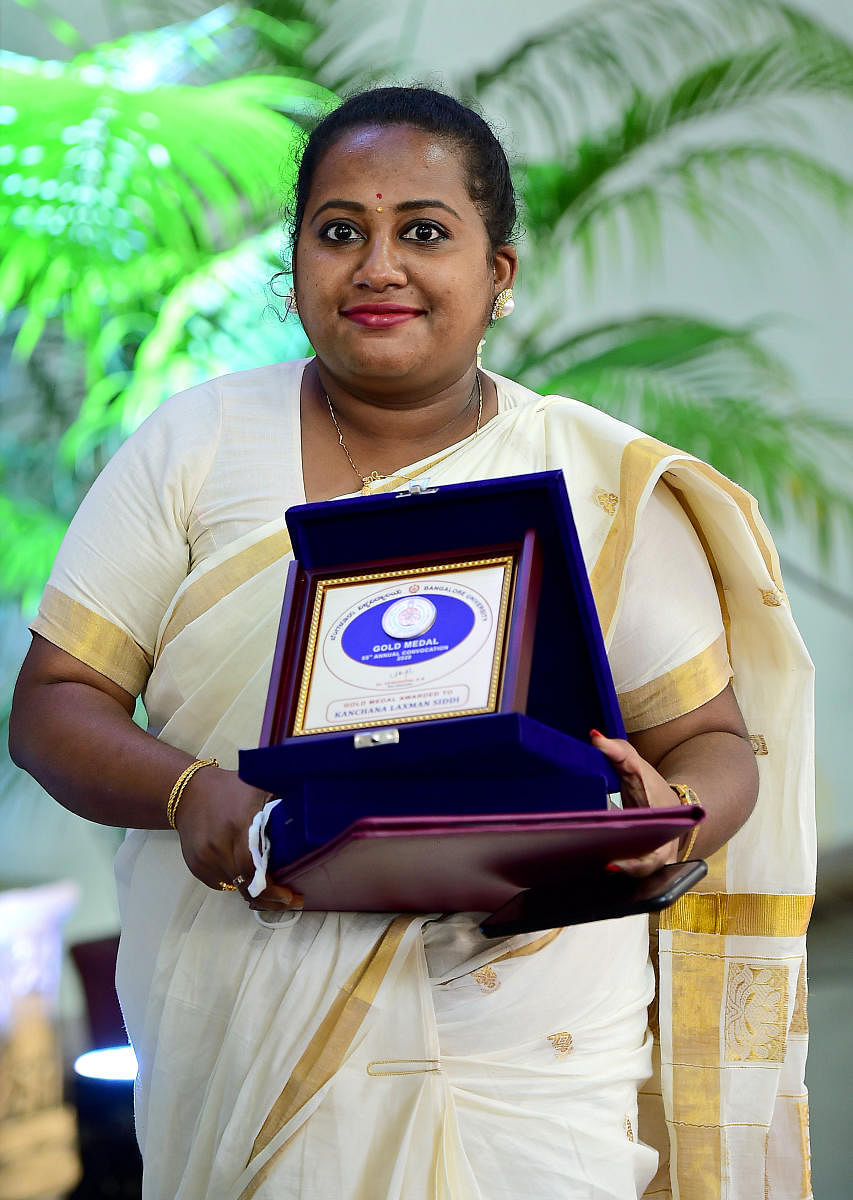 Kanchan Lakshmi Siddi with her gold medal at the 55th annual convocation of Bangalore University on Saturday. DH PHOTO/RANJU P