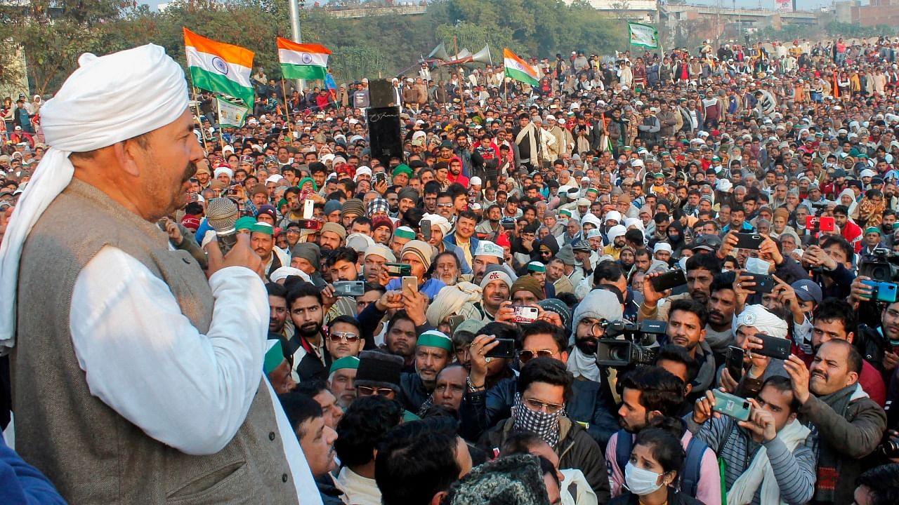 Bharatiya Kisan Union (BKU) President Naresh Tikait addresses during a 'Maha Panchayat', organised to mobilise support for the farmers' agitation at Delhi borders against Centre's farm reform laws, in Muzaffarnagar, Friday. Credit: PTI Photo