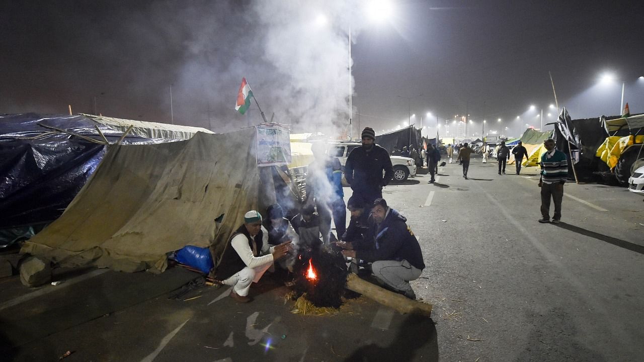 Farmers during their ongoing agitation over Centre's farm reform laws, at Ghazipur border in New Delhi. Credit: PTI Photo