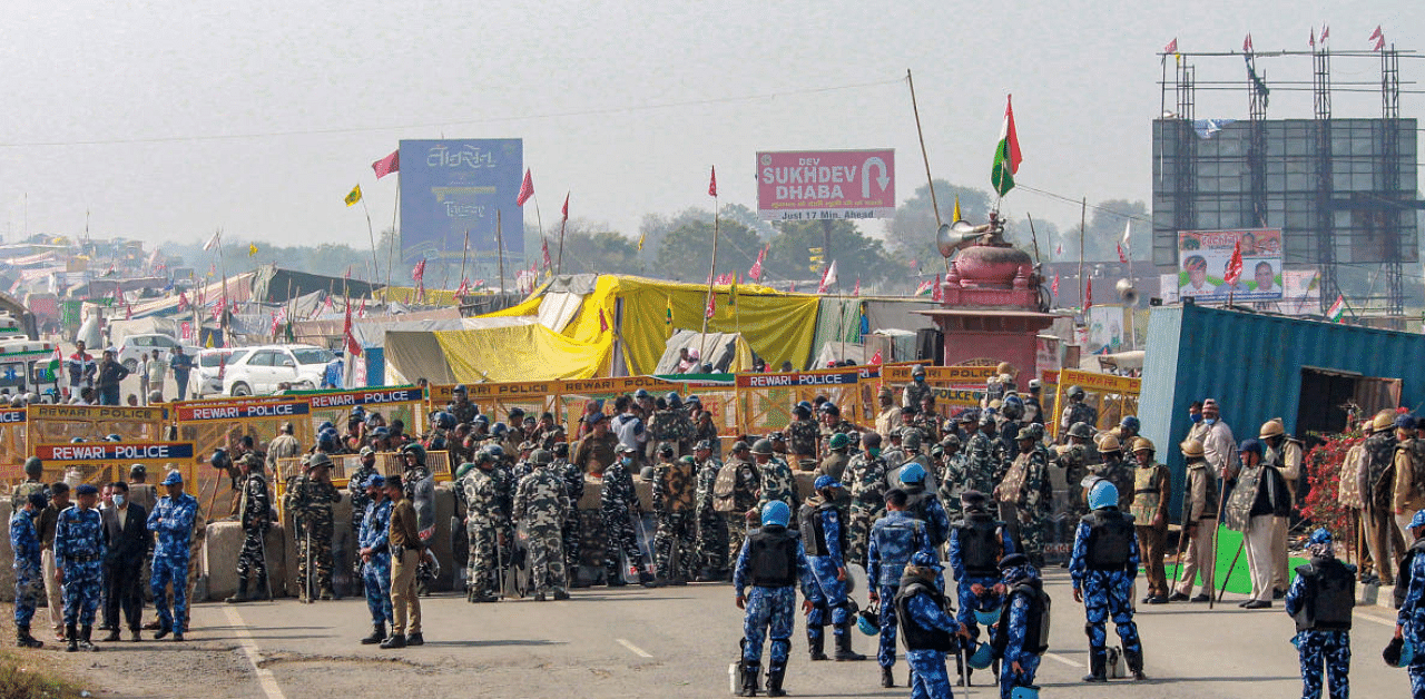  Security personnel stand guard at Rajasthan- Haryana Jaisinghpur Khera border during the ongoing farmers' protest against Centre's farm reform laws. Crediit: PTI Photo