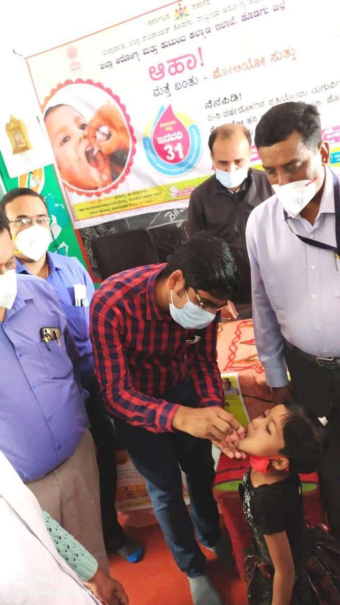 Kodagu Zilla Panchayat CEO Bhanwar Singh Meena inaugurates pulse polio drive in Kodagu on Sunday, by administering polio drops to a child.