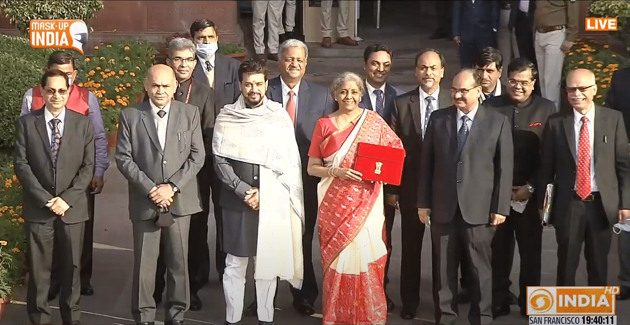 Finance Minister Nirmala Sitharaman with MoS Anurag Thakur, officials outside the Parliament ahead of the Budget speech. Credit: PTI Photo
