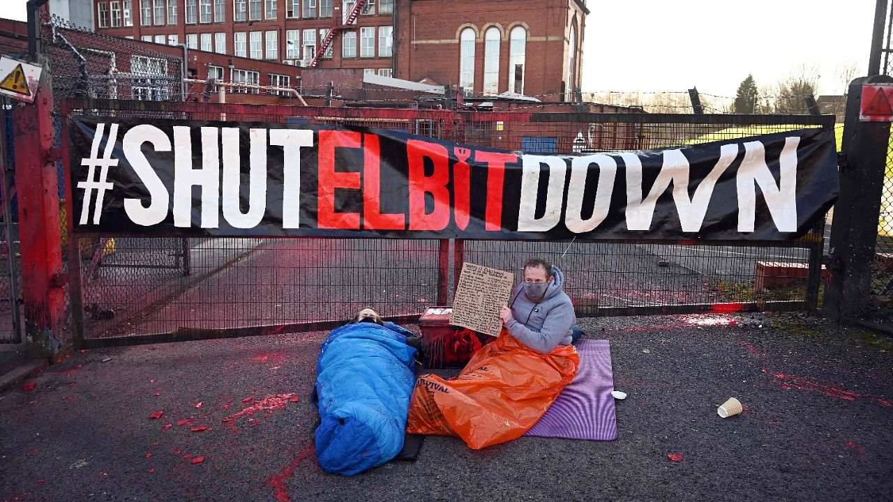 Activists from Extinction Rebellion North and Palestine Action protest at the gates of the Elbit Ferranti factory in Waterhead, Oldham in north-west England. credit: AFP Photo