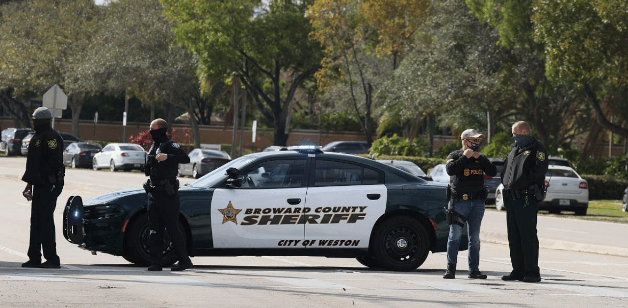 Law enforcement officers block off an area near where reports indicate that several FBI agents were shot as they served a warrant in a child exploitation case on February 2, 2021 in Sunrise, Florida. Credit: AFP 
