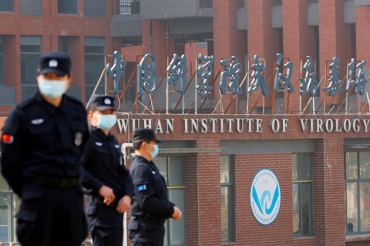 Security personnel keep watch outside the Wuhan Institute of Virology during the visit by the World Health Organization (WHO) team tasked with investigating the origins of the coronavirus disease (COVID-19), in Wuhan, Hubei province, China February 3, 2021. Cedit: REUTERS