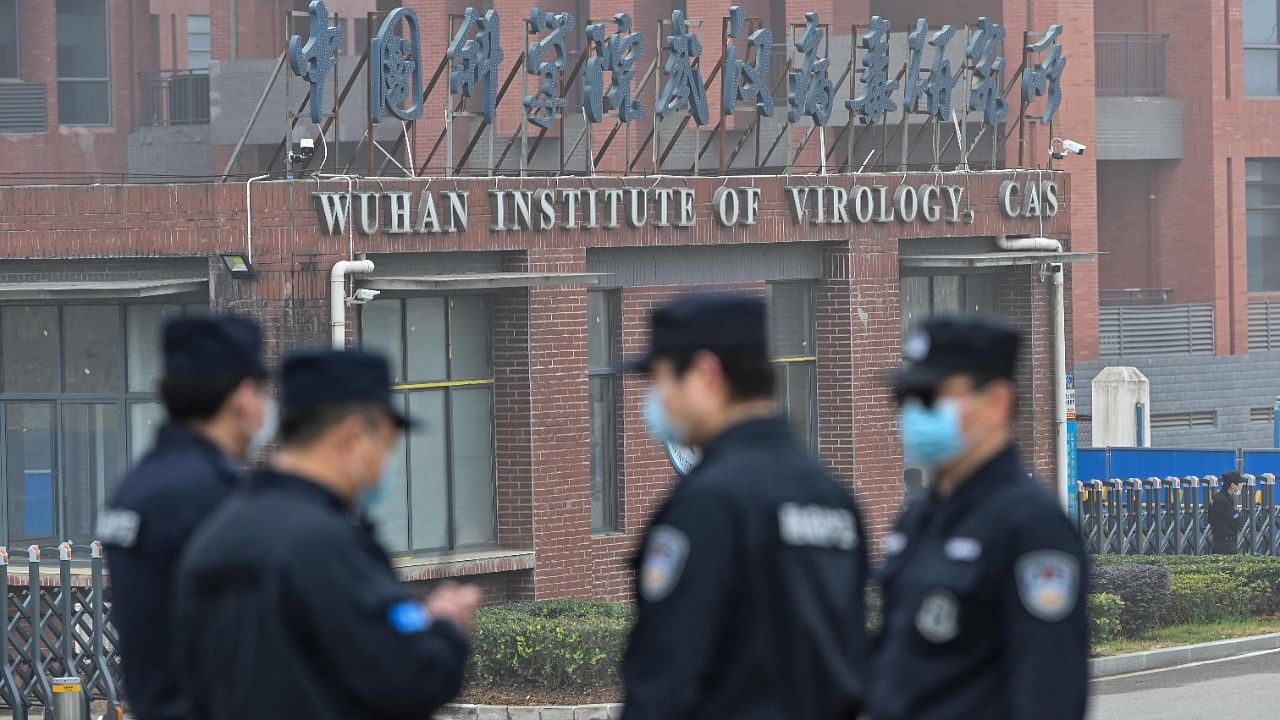 Security personnel stand guard outside the Wuhan Institute of Virology in Wuhan as members of the World Health Organization (WHO) team investigating the origins of the Covid-19 make a visit to the institute in Wuhan in China's central Hubei province on February 3, 2021. Credit: AFP Photo