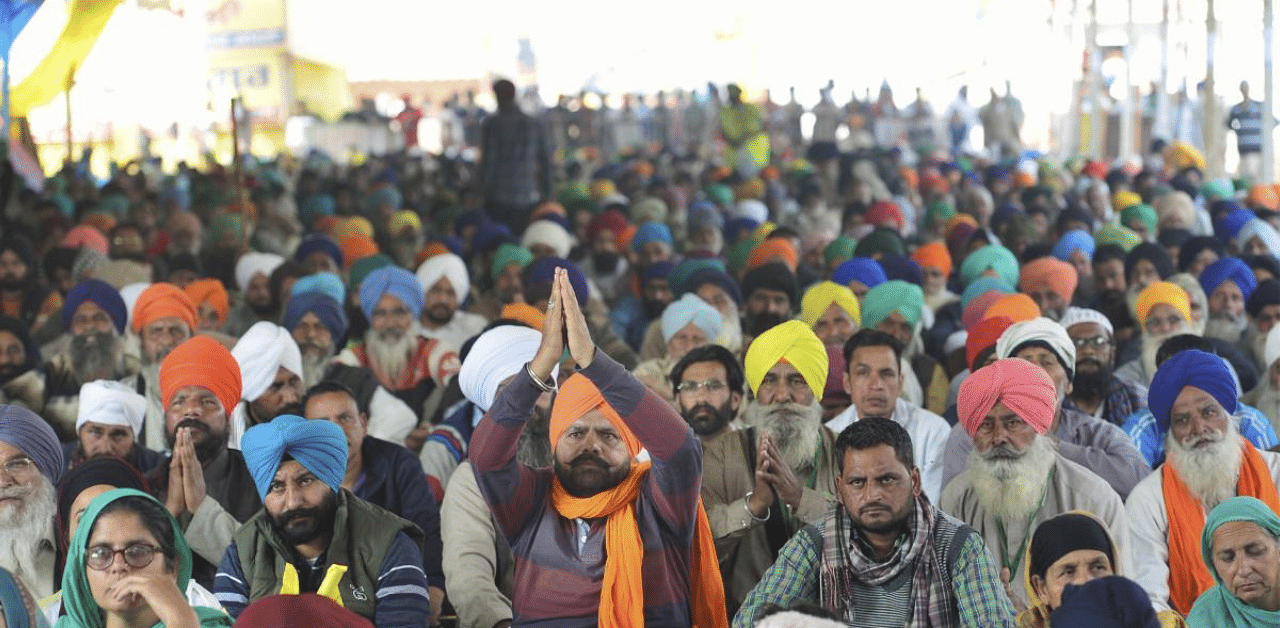 Farmers during their ongoing protest at Singhu Border, in New Delhi. Credit: PTI Photo