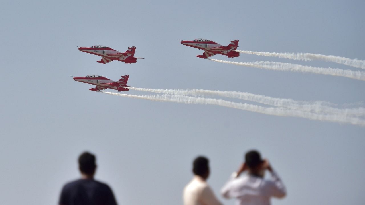  Indian Air Force (IAF)'s acrobatic team, 'Suryakiran', perform a sortie ahead of the AERO INDIA 2021 show at Yelahanka Air Base in Bengaluru. credit: PTI Photo