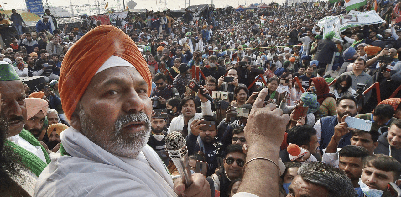 BKU Leader Rakesh Tikait speaks at a protest. Credit: PTI Photo