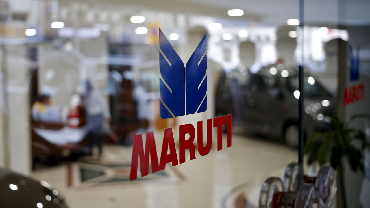 The logo of Maruti Suzuki India Limited is seen on a glass door at a showroom in New Delhi. Credit: Reuters Photo