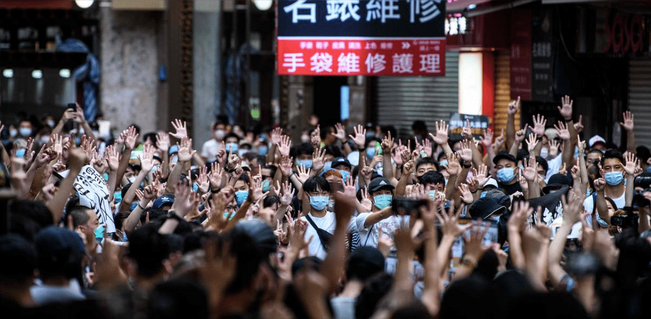In this file photo protesters chant slogans and gesture during a rally against a new national security law in Hong Kong on July 1, 2020, on the 23rd anniversary of the city's handover from Britain to China. Credit: AFP photo. 