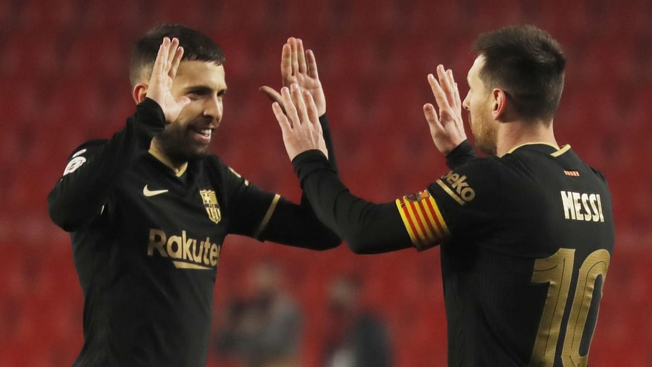 Copa del Rey - Quarter Final - Granada v FC Barcelona - Nuevo Estadio de Los Carmenes, Granada, Spain - Barcelona's Jordi Alba celebrates with Lionel Messi after the match. Credit: Reuters.