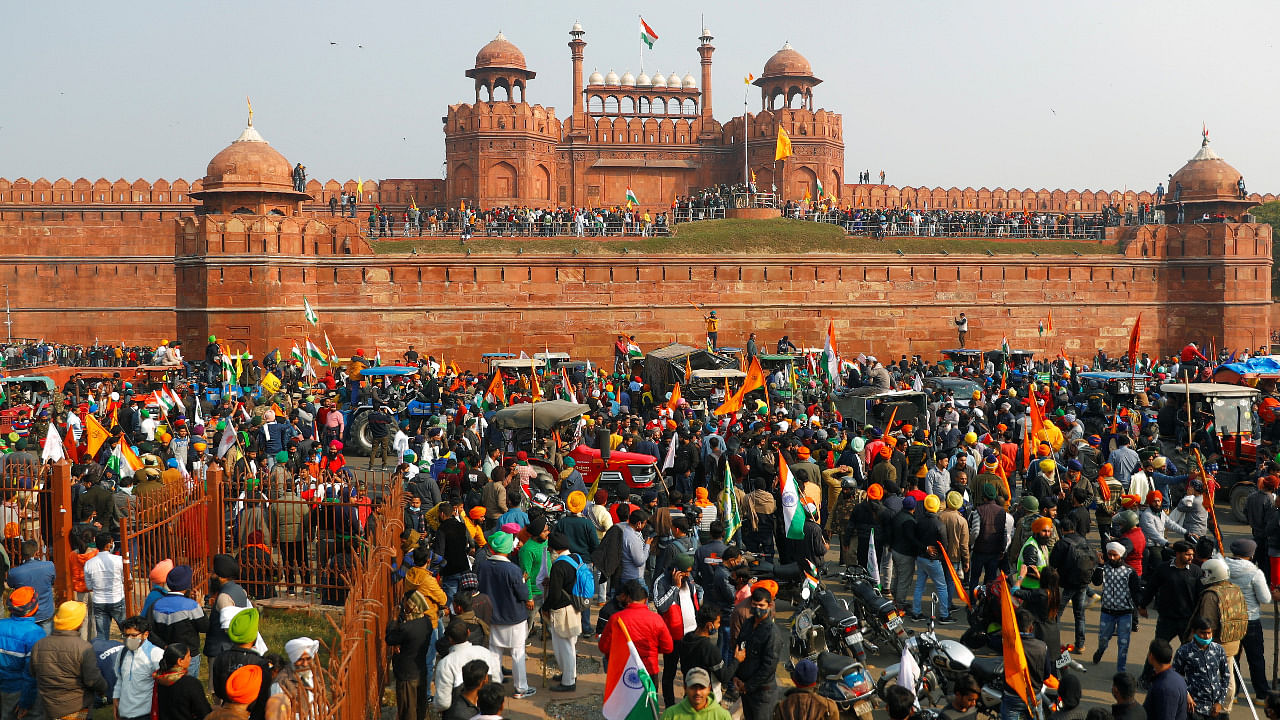 Farmers gather in front of the historic Red Fort during a protest against farm laws. Credit: Reuters Photo