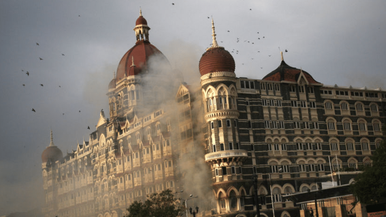 Firefighters attend to a fire as it burns at Taj Mahal Palace & Tower Hotel following an armed siege on November 29, 2008 in Mumbai, India. Credit: Getty Images