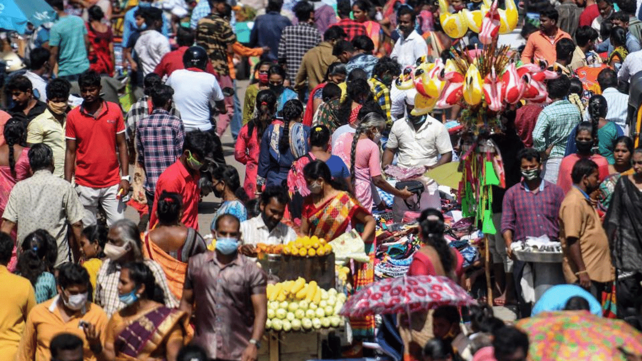 People gather for shopping at a market ahead of Diwali, the Hindu festival of lights, in Chennai on November 13, 2020. Credit: AFP Photo