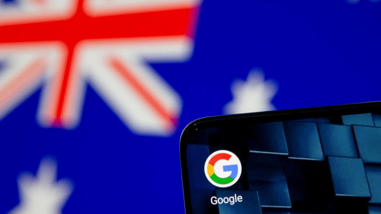 A smartphone with a Google app icon is seen in front of the displayed Australian flag in this illustration, January 22, 2021. Credit: Reuters File Photo