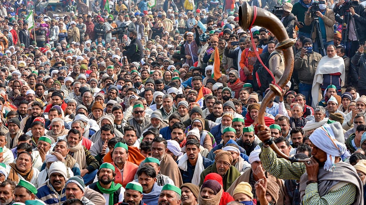 Villagers, farmers and supporters attend a 'Maha Panchayat', organised to mobilise support for the farmers' agitation at Delhi borders against Centre's farm reform laws, in Muzaffarnagar. Credit: PTI file photo.