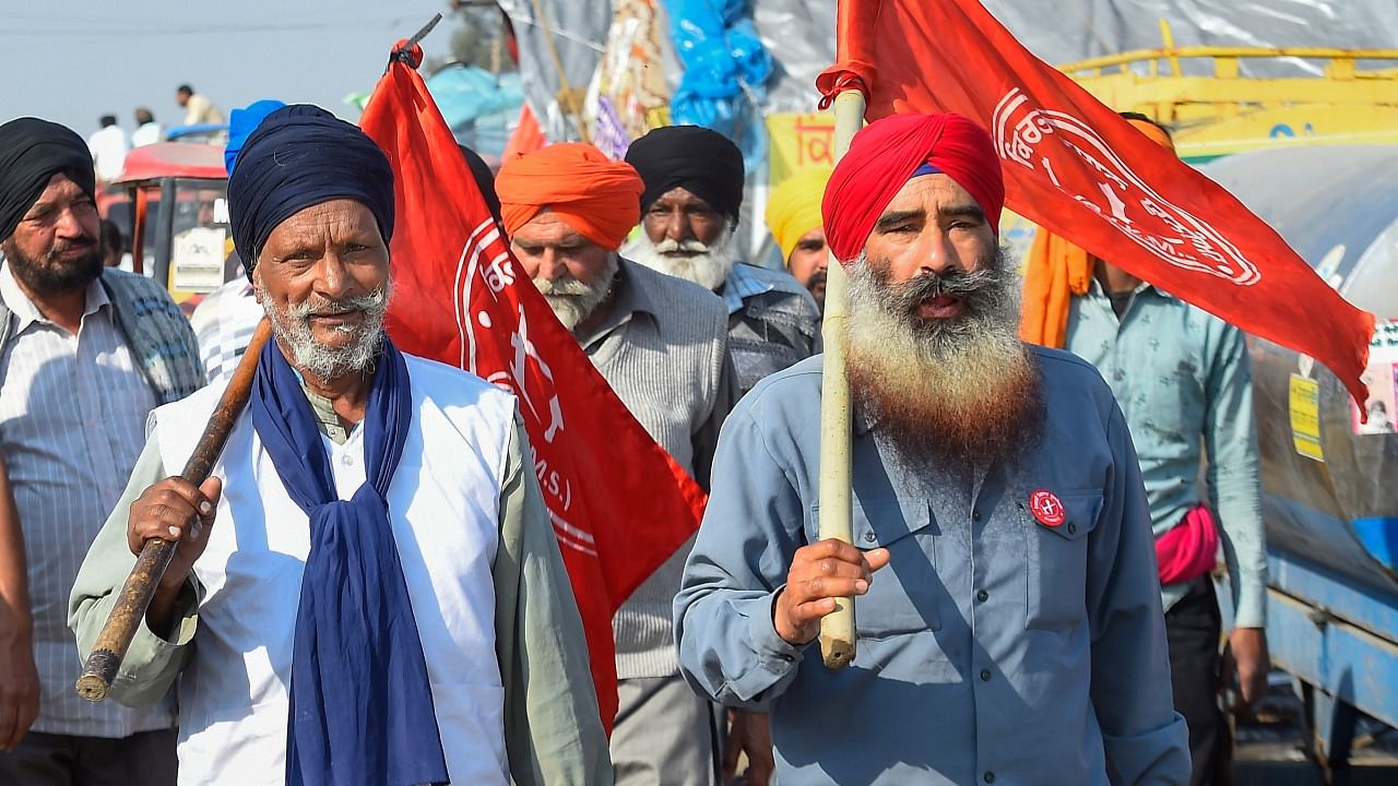  Farmers at Singhu border during their ongoing protest against three farm laws, in New Delhi. Credit: PTI File Photo.