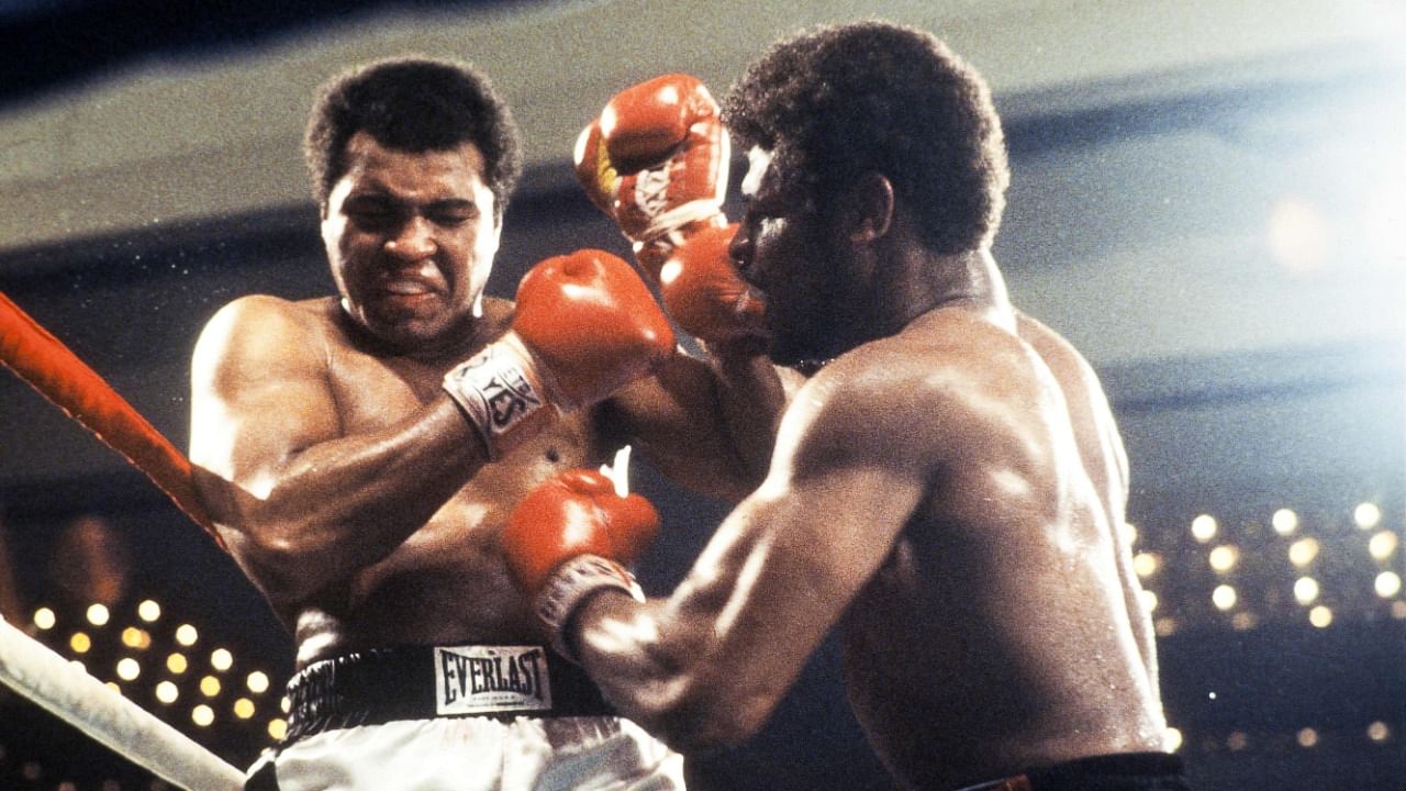 In this file photo taken on February 15, 1978 World heavyweight champion Muhammad Ali (L) and US Leon Spinks (R) fight in Las Vegas during their world heavyweight championship match. Credit: AFP Photo